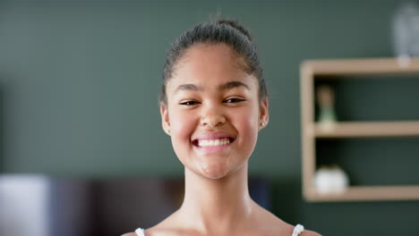 Portrait-of-happy-african-american-girl-smiling-and-laughing-in-living-room,-slow-motion