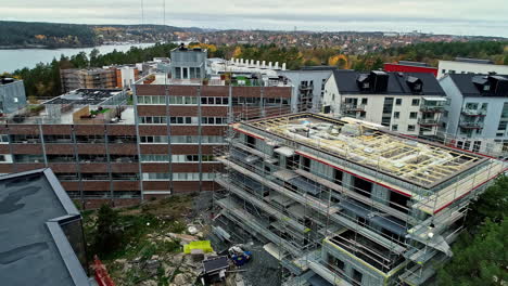 aerial flyover construction site with new build apartment blocks in stockholm,sweden