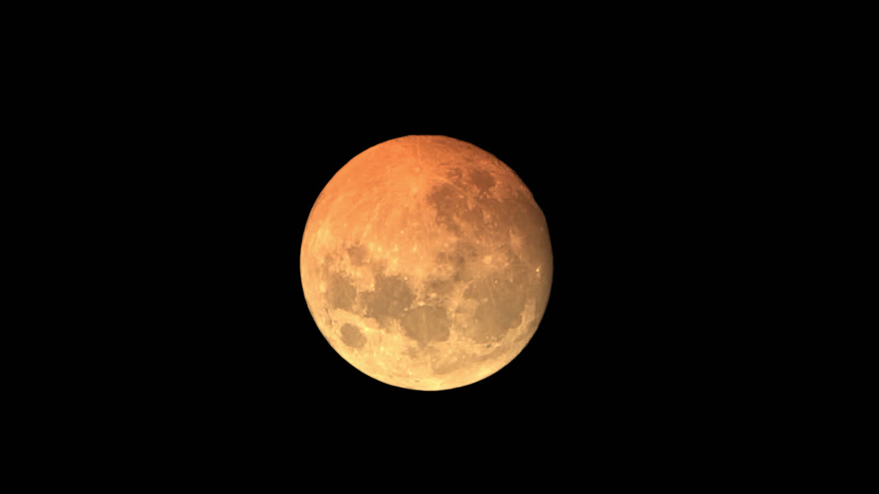Large Orange Full Moon Setting Quickly In The Night Sky, Astronomical Event