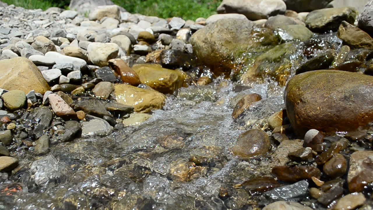 Stones in the mountain river. Current in the mountain river