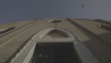 low angle view of a brick church facade