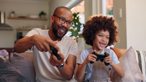 father and son enjoying video games together at home