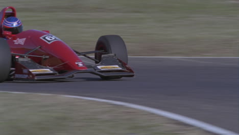 a formula car drives on a circuit track 5