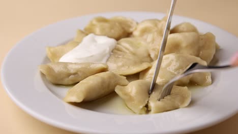 pierogi with sour cream