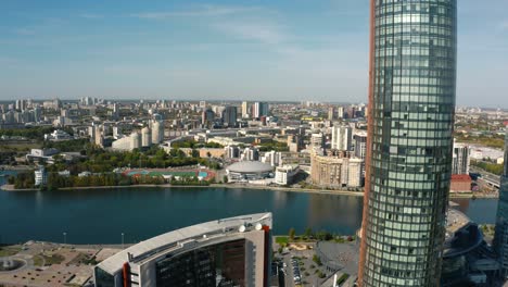 panoramic view of a city with a modern skyscraper and river