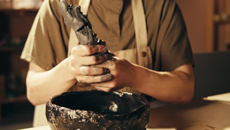 artisan shaping clay