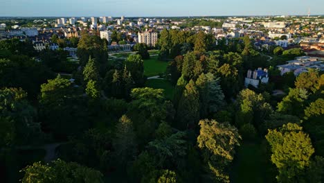 thabor park, rennes in brittany, france. aerial forward