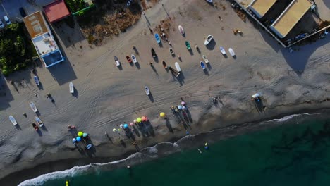 drone top shot descending over a beach in spain, near gibraltar