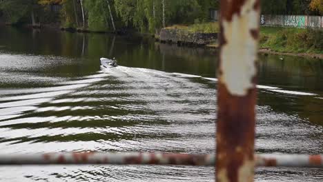 the boat roars down the river