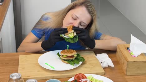 woman eating a delicious homemade burger