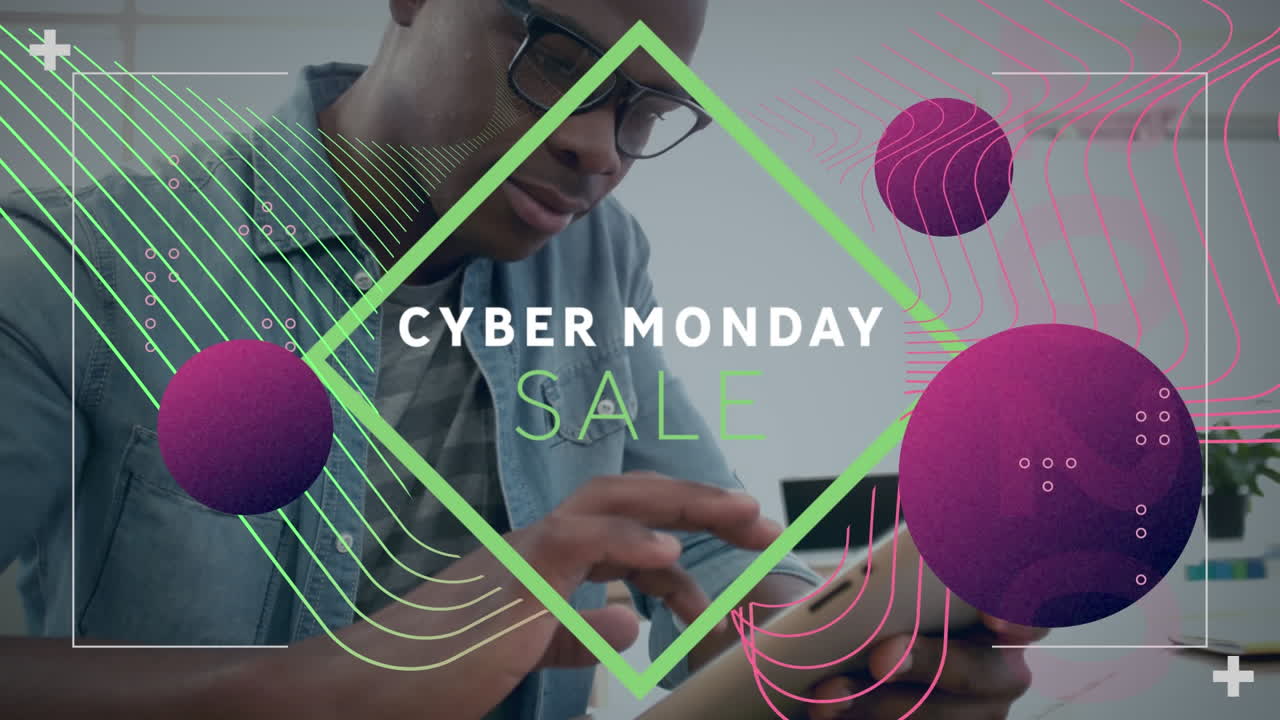 Video of cyber monday sale text and graphics while african american young man using tablet pc