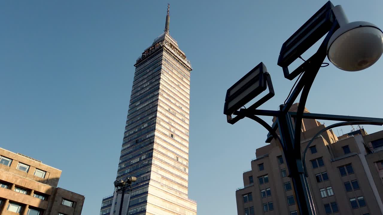 Tall Torre Latinoamericana rising among surrounding buildings on a clear day