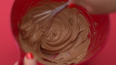 Mixing-ice-cream-and-chocolate-while-making-homemade-ice-cream