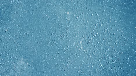 oxygen bubbles in water on a blue abstract background