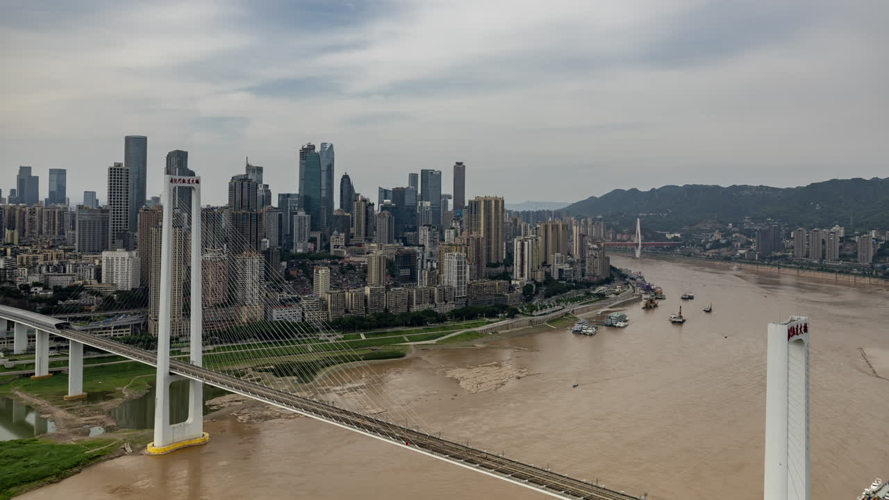 Timelapse of the amazing Chongqing cyberpunk city skyline from a high vantage point wirh the yangtze river