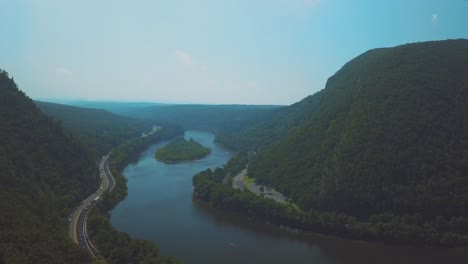 Aerial-shot-of-the-highway-by-the-river