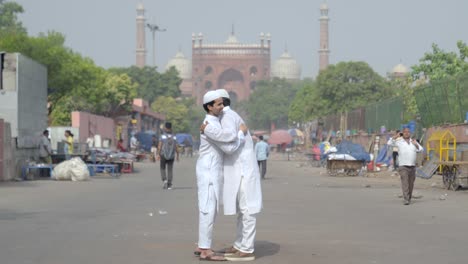 indian muslim men celebrating eid festival in front of jama masjid delhi