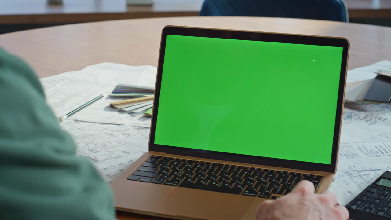 Freelancer working mockup laptop at home workplace closeup. Unknown businessman