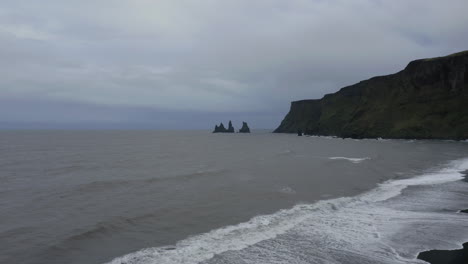 Drone-panoramic-shot-of-Reynisfjara-black-sand-beach-in-the-southern-coast-of-Vik-in-Iceland