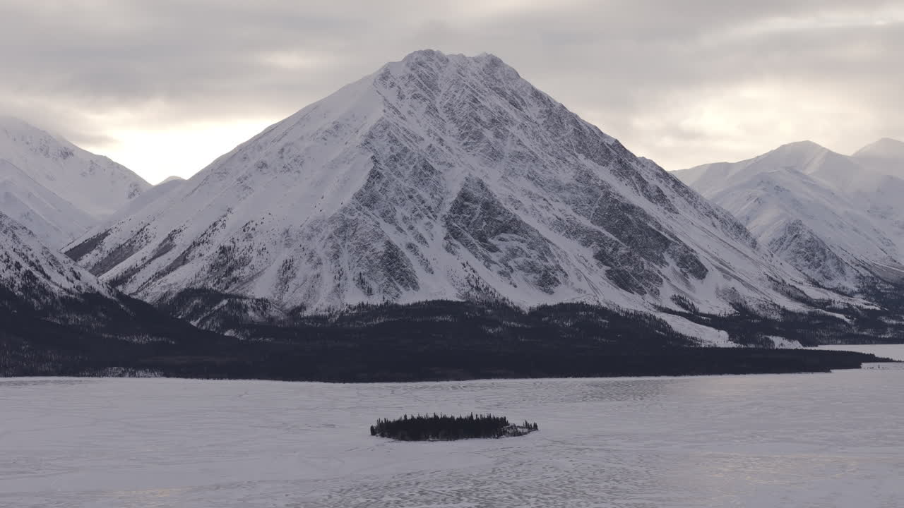 Scenic Snow Mountains During Sunset In Kathleen Lake In Yukon, Canada. Aerial Wide Shot