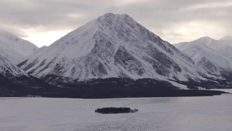 scenic snow mountains during sunset in kathleen lake in yukon, canada. aerial wide shot