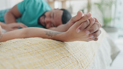 love, holding hands and couple in bedroom