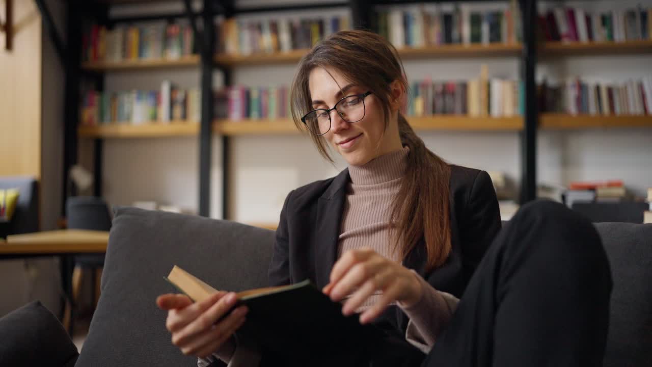 Woman Reading a Book in a Cozy Library Cafe