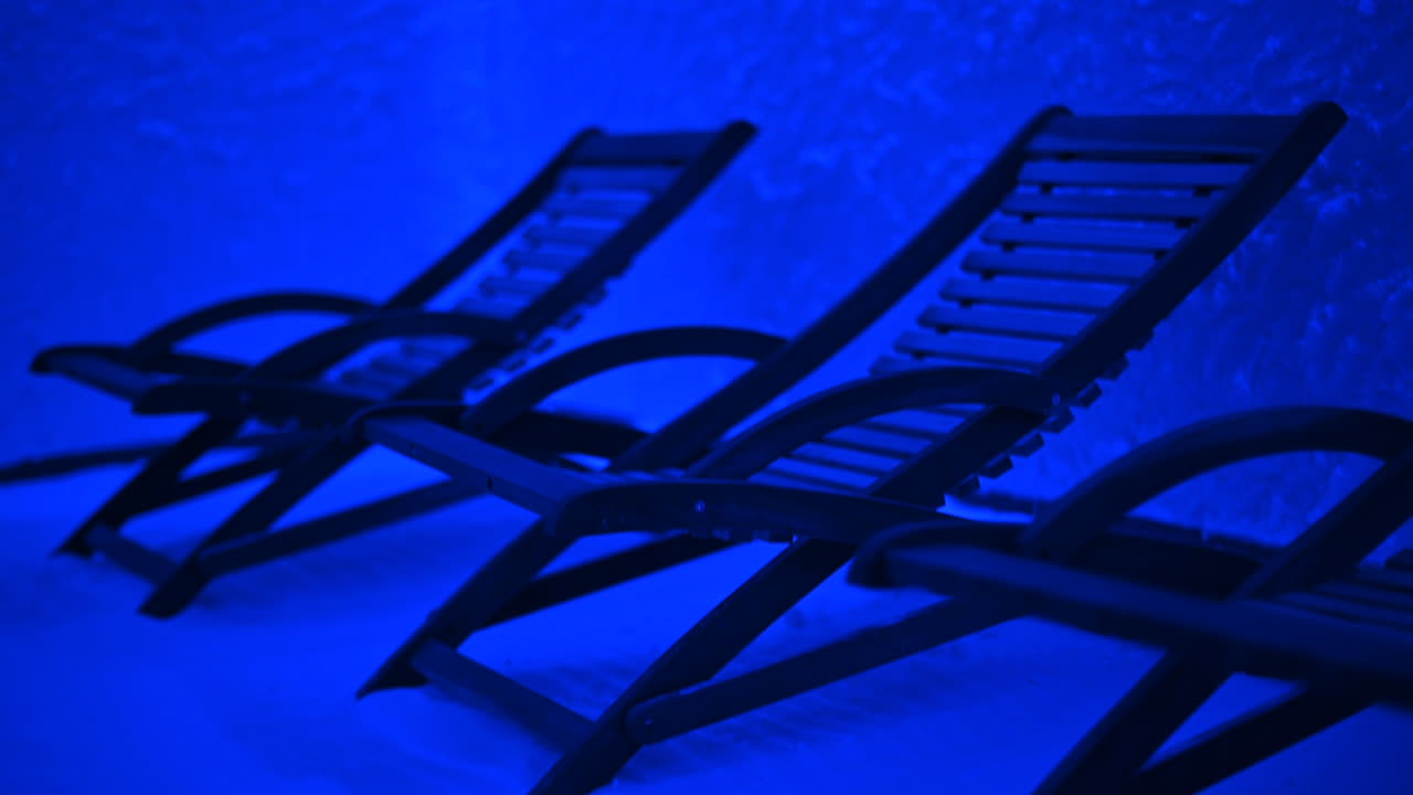 Resting chairs in a salt room with blue light