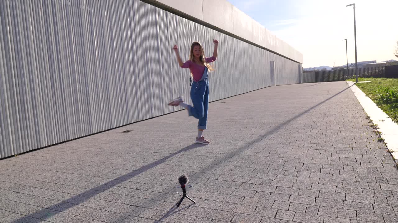 Woman Dancing and Vlogging Outdoors