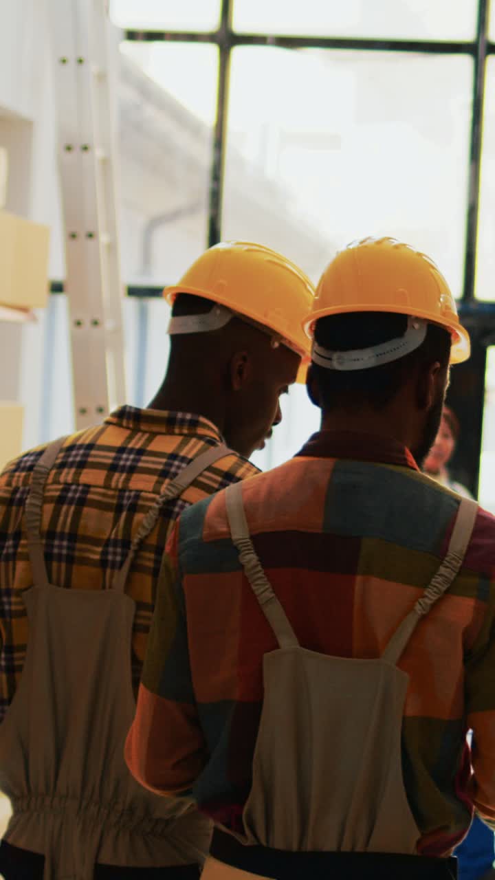 Vertical video: Team of people working on inventory with scanner