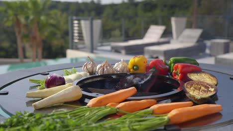 various selection of vegetables roasting on the rooftop bbq during the summer