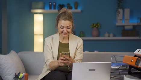 home office worker woman getting good news on the phone.