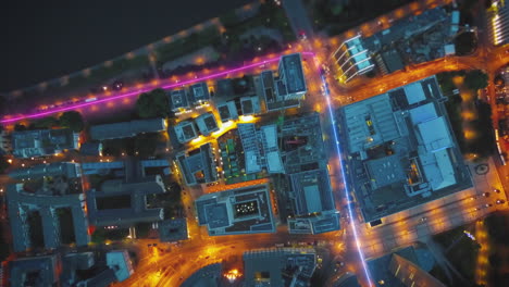 Top-down-hyper-lapse-footage-of-traffic-in-urban-borough-at-night.-Visual-effect-highlighting-traces-of-vehicles.-Frankfurt-am-Main,-Germany