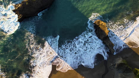 drone flying over the beach towards the ocean