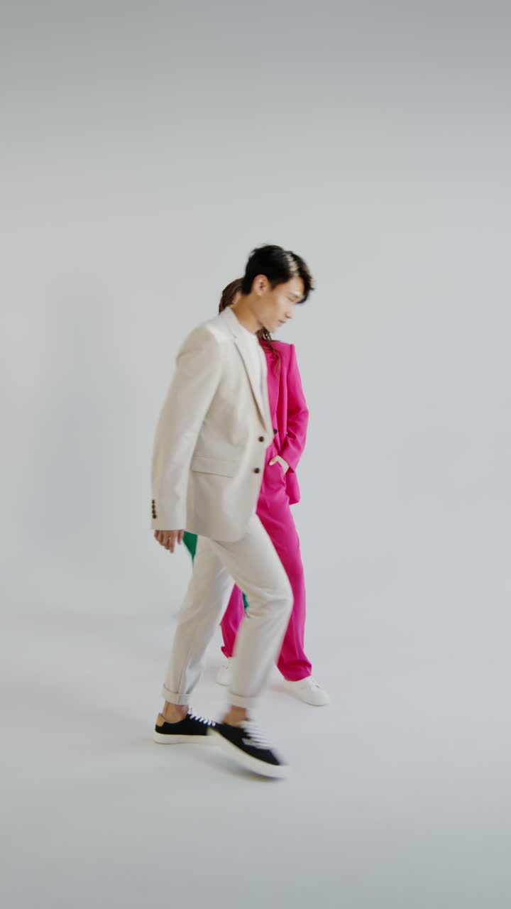 Fashionable People Wearing Stylish Suits