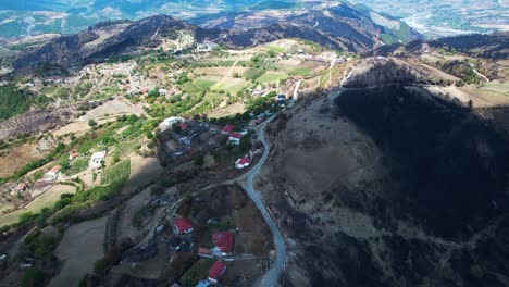 burned houses from forest fires in a mountain village of albania, consequences of global warming