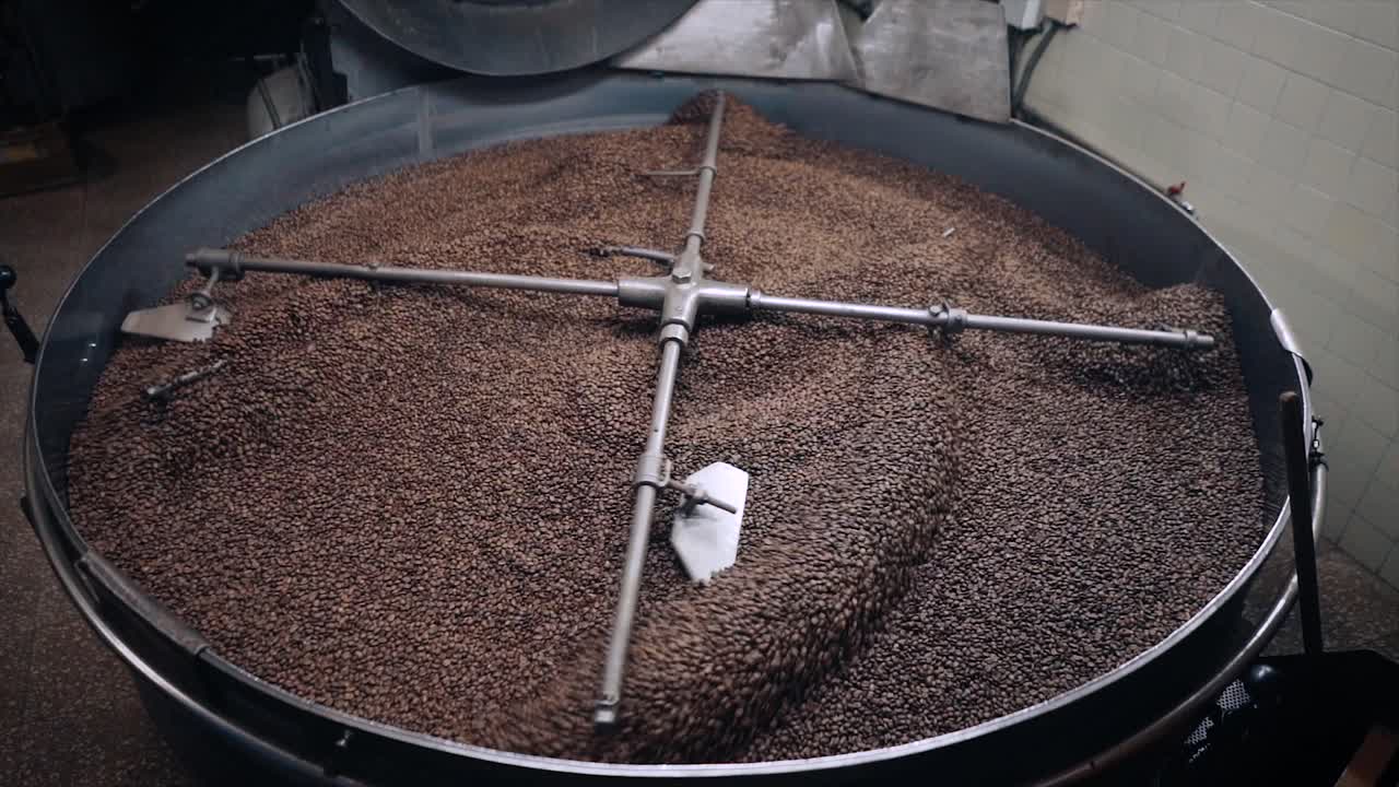 Coffee Roasting Process - Coffee beans in roasting machine. Overview.