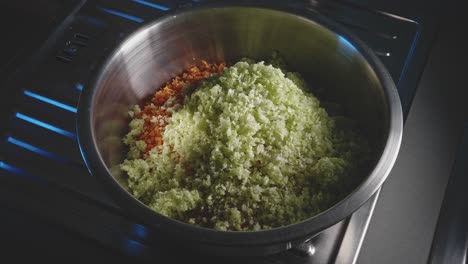 stop motion of chopped vegetables and oatmeal ingredients in a mixing bowl