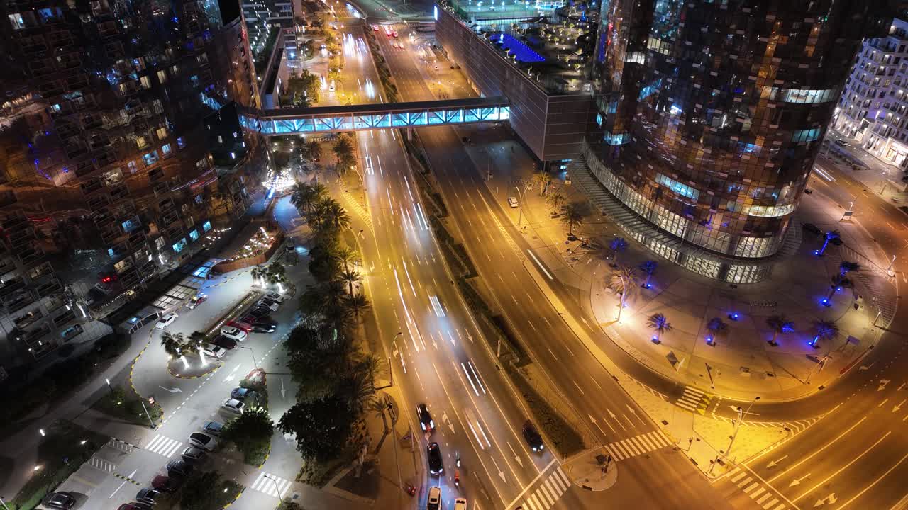 Busy city traffic at nighttime in Abu Dhabi, United Arab Emirates on Al Reem Island - time lapse