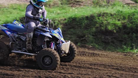 quad bike driver leaning into a turn