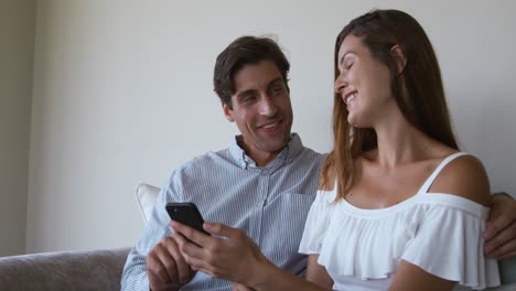 Caucasian-couple-using-a-phone