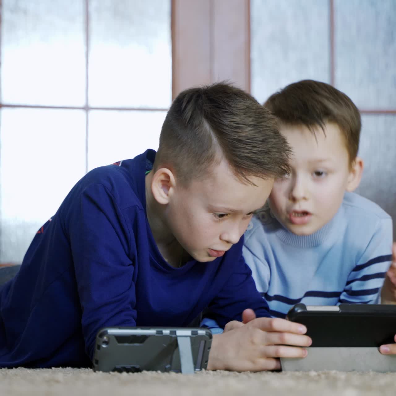 Two kids with gadgets