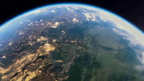 la tierra desde el espacio por la noche con las luces de la ciudad