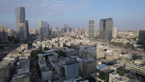 drone-shot-over-an-industrial-area-in-front-of-office-buildings-on-a-working-day---high-altitude