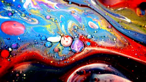 abstract colorful acrylic and food paint bubbles on water