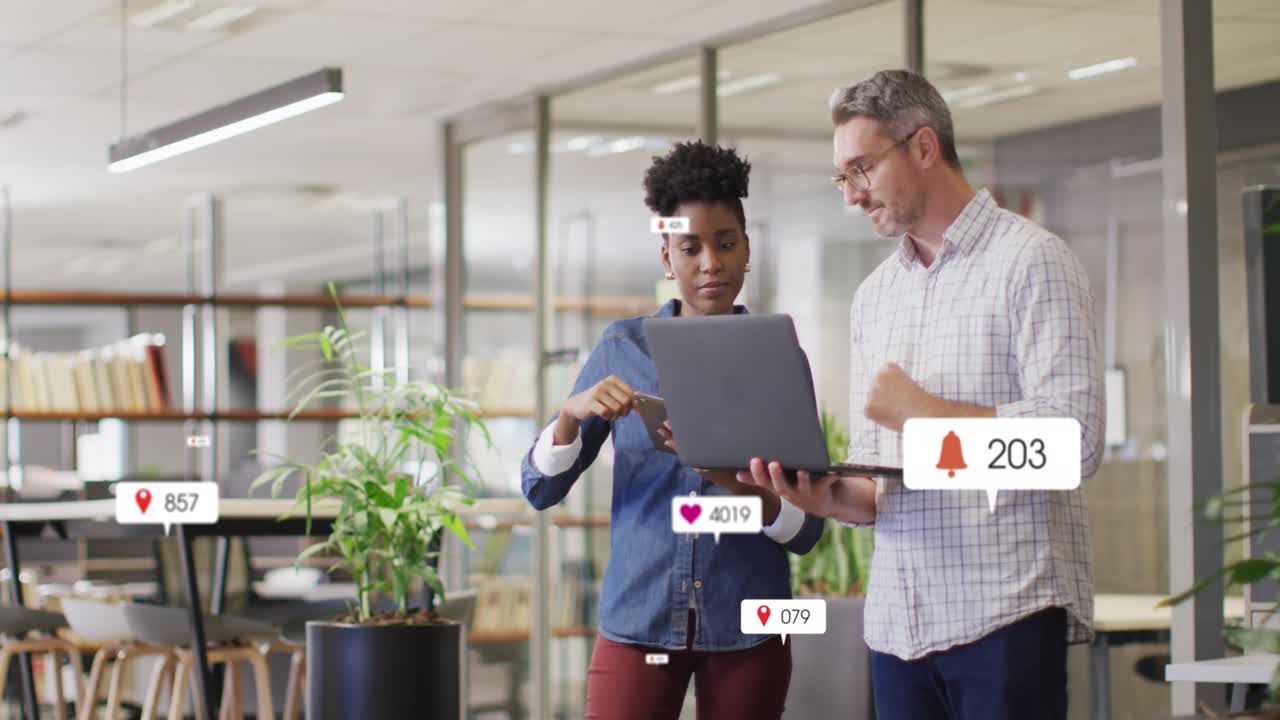 Animation of multiple notification bars over diverse coworkers discussing reports on laptop