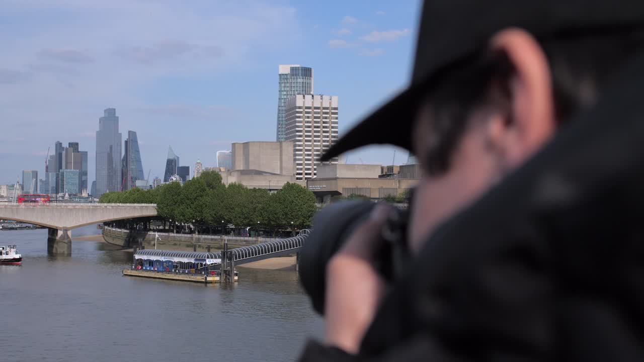 Photographer taking picture of Waterloo Bridge in London
