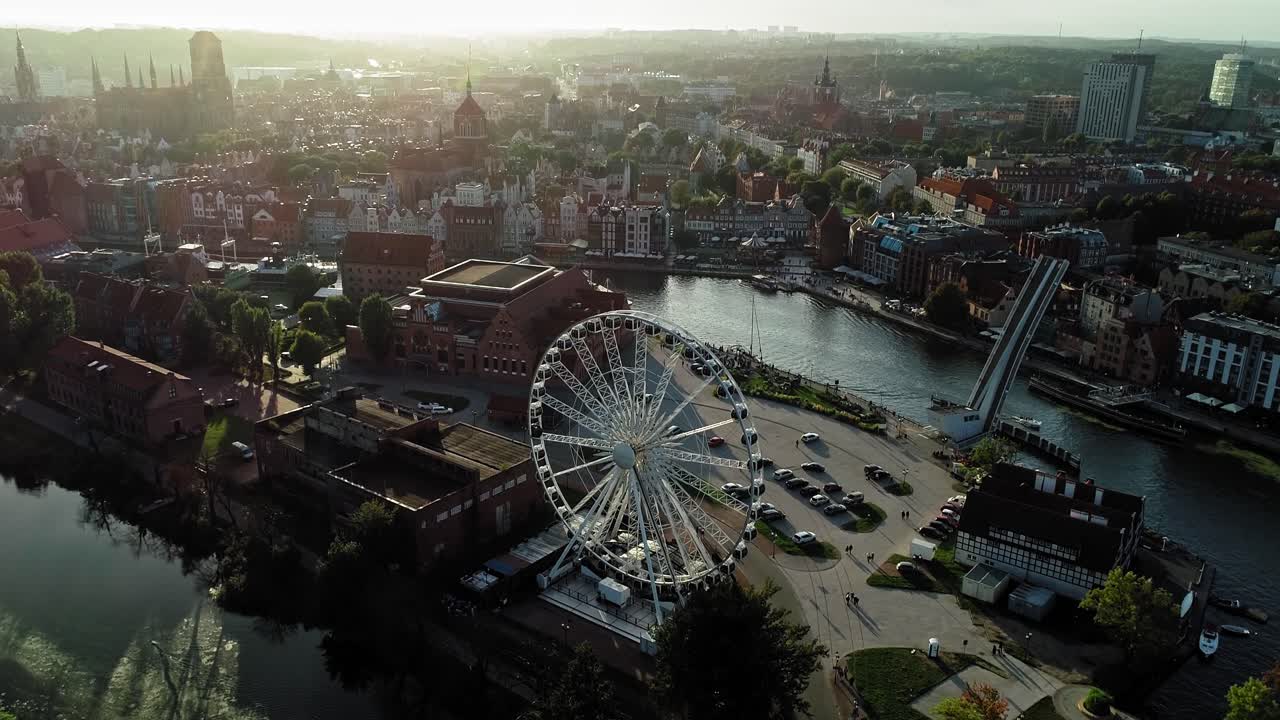 Aerial shot of Polish Baltic Philharmonic, ferris wheel and Gdańsk old town in pomeranian voivodeship, Poland