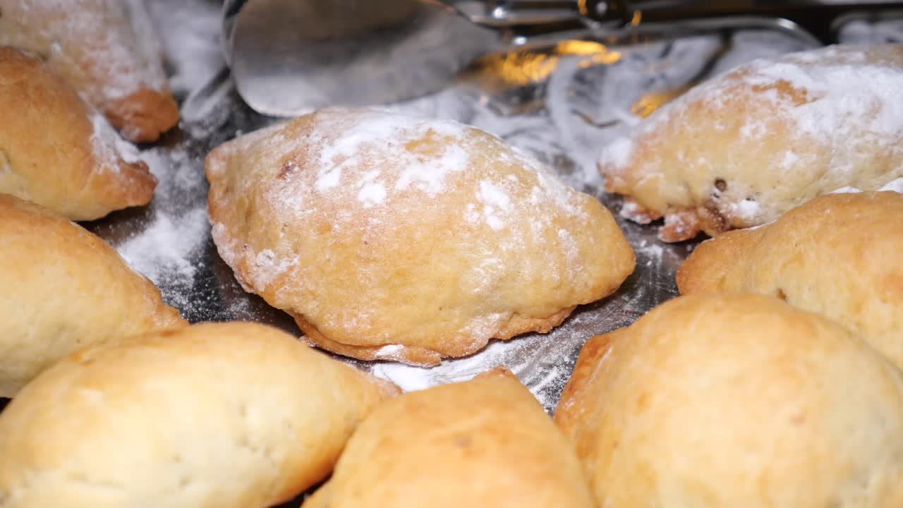 Assortment of pastries dusted with powdered sugar