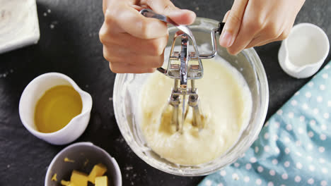 woman whisking batter in a bowl 4k